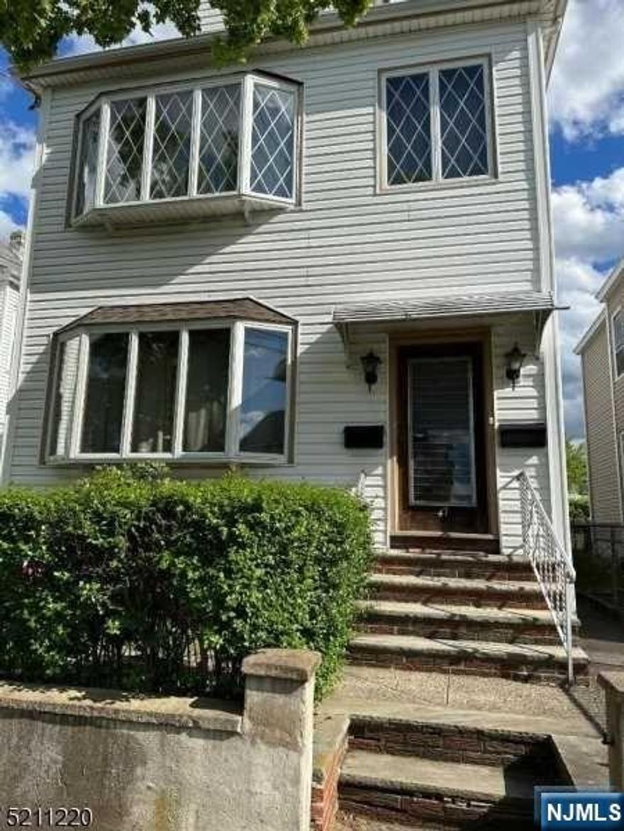 Great 2-family home with full walk-up attic with additional rooms & full unfinished basement. Separate utilities. Two Washer dryer hooks ups. Easy access to highways, shopping & public transportation. Easy commute to NYC. Being sold as is.