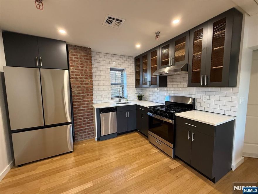 Modern 2 bedroom apartment on Liberty Street in Little Ferry featuring an open concept living room/kitchen. Nestled on top of printing studio (non retail) and just steps away from bus transportation. In unit laundry, spacious bedrooms with tons of light, quartz countertops, modern finishes throughout, hardwood floors, central air, and top notch appliances. This modern apartment is calling your name. Pets are conditional please inquire. Parking is included.