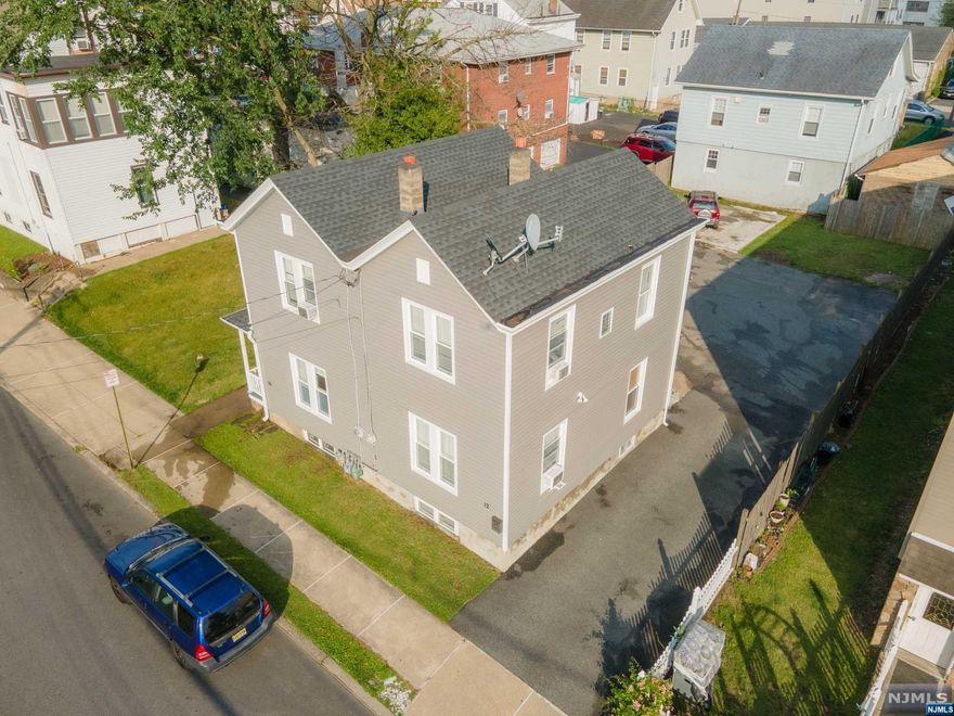 Welcome home to this beautiful two family in Haledon. Close to parks, schools, public transportation and houses of worship. This side-by-side duplex style home offers a living room, eat in kitchen, bathroom on the first floor and two bedrooms on the second floor of each unit. Left side renovations include kitchen, flooring, and roof (2021), bathroom re-model (2022) and brand new vinyl siding (2023) Washer/dryer in left side basement included in sale, hook ups in right side basement only. Park up to 8+ cars on property. Cooling is window ACs for both sides. Baseboard heat left side and forced hot air in right side unit. 1-year Home Warranty Included with sale.