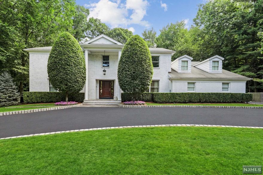 Make this idyllic 4-bedroom, 3.5-bathroom center hall colonial your family's home. Beautiful entryway leads to a 2-story foyer. Expansive living room and family room with working fireplace and double French doors access a large patio. Elegant 12-seat dining room. Large eat-in kitchen overlooks the huge backyard. A half-bath, mud room & 3-door garage complete the first floor. Second floor features the main bedroom suite, three additional bedrooms, two additional full bathrooms & large game room/den with a deck that leads to the backyard via an iron spiral staircase. Finished basement offers ample space for games & exercise equipment. Significant upgrades include California Closets and built-in speakers throughout the home. This 1-acre property has a large pool & hot tub, bocce court & storage shed. This home affords a perfect combination of living comfortably and entertaining lavishly. Excellent schools, low taxes & close proximity to New York City. Seller is an NJ licensed Realtor