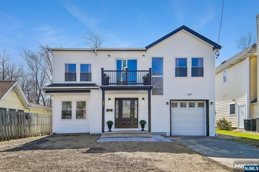 Completely rebuilt on an expanded foundation in 2026, this like-new home offers modern construction, clean design, and turnkey living. New HVAC, roof, and siding are paired with hardwood floors throughout, creating a cohesive, move-in ready interior. The main level features a spacious living room, formal dining area with sliding doors to a large deck, a well-scaled powder room, and a modern kitchen with white cabinetry and quartz countertops. Upstairs offers four generously sized bedrooms, including a primary suite with two walk-in closets and a private bath. One secondary bedroom includes a walk-in closet, while another opens to a private balcony. A full hall bath and second-floor laundry complete the level. Additional features include a one-car garage, 2 car driveway, and a flat, fully fenced backyard with both patio and deck for outdoor use. Convenient access to major transportation, shopping, and daily essentials.