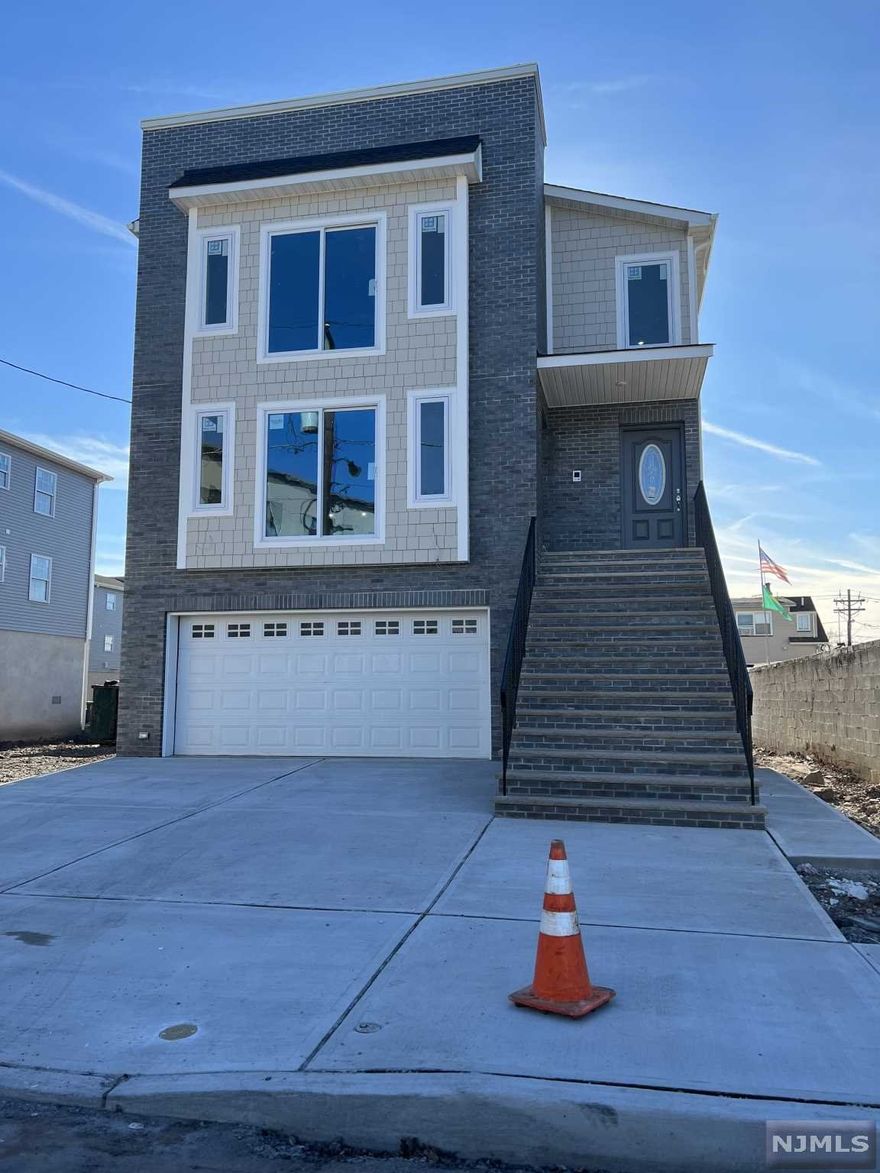 CUSTOM BRICK FACADE - CHOOSE YOUR COLORS NOW. 30 YEARS DIMENSIONAL ROOFING. GRANITE AND QUARTZ KITCHEN COUNTERTOPS. STAINLESS STEEL APPLIANCES. WASHER/GAR DRYER HOOKUPS FOR EACH UNIT. CERAMIC TILED FLOORS. HARDWOOD FLOORS. CUSTOM VANITIES. CEILINGS WITH 8 FEET HIGH. TWO CAR GARAGE. BACK TOP DRIVEWAY. 10 YEARS HOME WARRANTY.