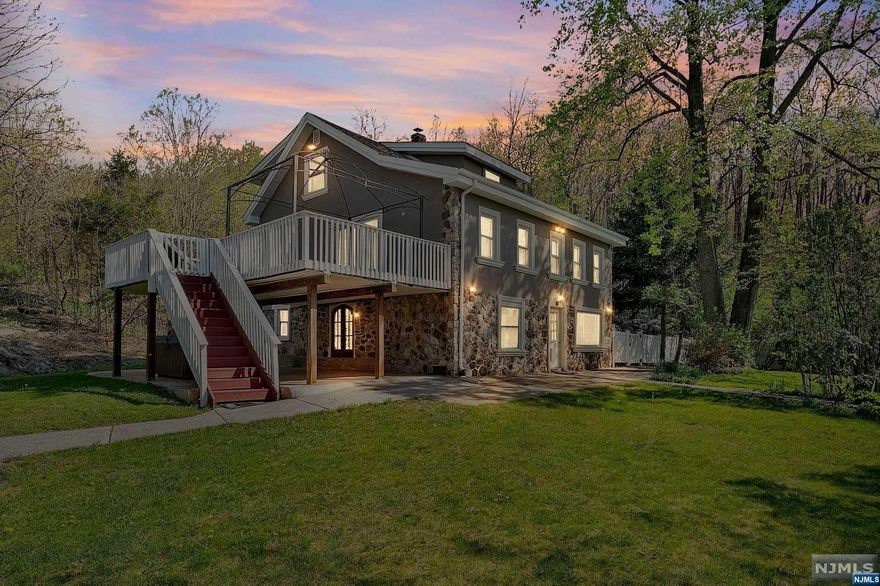 House and Cottage. This stunning property in Lower West Milford is a haven for comfortable and versatile living. The main home spans three levels and has been tastefully updated throughout. The first floor features a well-equipped kitchen with a breakfast bar and ample cabinet space, a cozy living room, a dining room with sliders to a deck, a peaceful master bedroom, and a full bathroom. The second floor offers a spacious landing area, two bedrooms, an office or study nook, a beautifully designed full bathroom, and a convenient powder room. The walk-out basement includes newly laid flooring in the family room and office/den area, an expansive laundry room, another full bathroom, and a patio area with a hot tub, ideal for relaxation and entertainment. Multiple driveways provide ample space for business equipment, trailers, and multiple vehicles. In addition, the property includes a separate cottage home, perfect for hosting or serving as an in-law suite or private office. Must see.