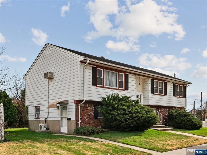 Nestled at the end of a peaceful cul-de-sac, this meticulously maintained bi-level home offers the perfect blend of space and convenience. The bright main level features an inviting living and dining area, complemented by four spacious bedrooms and two full baths. The versatile ground floor provides effortless indoor-outdoor flow with walk-out access from two roomsâ€”ideal for a home office or guest suiteâ€”alongside a large two-car garage with ample storage. Perfectly situated near top-rated schools, parks, shopping, and easy NYC transit.