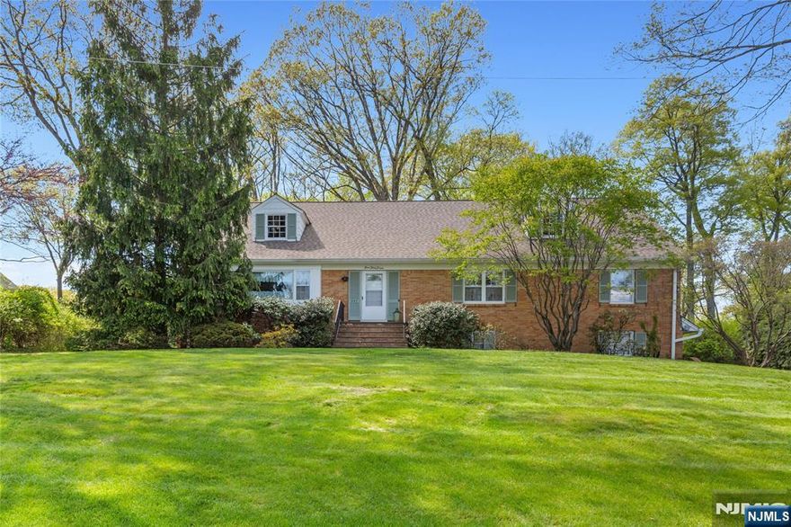 Classic charm, expansive property, and endless potential in Wyckoffâ€™s sought-after neighborhoods. Welcome to 557 Taunton Road, a spacious 5-bedroom home set on a beautifully landscaped property. Nestled on a generous lot of approximately 0.57 acres, this home offers both privacy and a serene, park-like setting surrounded by mature trees. The main level features well-proportioned living spaces filled with natural light, including a formal dining room, inviting living areas, and a large eat-in kitchen overlooking the scenic backyard. The homeâ€™s layout provides flexibility with multiple gathering spaces, including a cozy den and a finished lower level with a fireplace, ideal for recreation or extended living. Upstairs, youâ€™ll find five spacious bedrooms, offering ample room for everyone. A standout feature is the expansive attic space, presenting incredible potential for future expansion, storage, or customization to suit your needs. Additional highlights include a multi-car garage, a large driveway for ample parking, and a peaceful outdoor setting ideal for relaxing, entertaining, or creating your dream backyard oasis. Located in the highly regarded township of Wyckoff, known for its suburban charm, strong sense of community, and top-rated schools. This home offers the perfect balance of tranquility and convenience. Whether youâ€™re looking to move right in or bring your vision to life, this property presents a rare opportunity in a premier location.