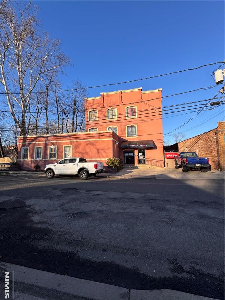 Exceptional mixed-use investment and redevelopment opportunity in the vibrant downtown district of Plainfield. Located at 12-18 Washington Ave, Plainfield NJ 07060 (Lots 9,16,17 & 18) This Property sits in a prime urban-suburban mixed-use corridor with strong visibility and convenient access to local amenities and transportation. The Property currently features multiple income-generating components, Including an operating daycare, a warehouse space with a loading dock, a juice bar and two residential apartments. The residential units consist of one spacious 2-bedroom, 2 bath apartment and one 1-bedroom, 1 bath apartment, offering additional rental income potential. A dedicated parking lot entrance from Washington Ave provides approximately six off-street parking spaces, adding valuable convenience for tenants and visitors. With its large combined lot and prime downtown location, this property presents an outstanding opportunity for investors, developers, or owner-users. The site is well suited for future redevelopment into a modern mixed-use residential and commercial building, capitalizing on the continued growth and revitalization of the Plainfield downtown area. A rare chance to acquire a versatile property with existing income streams and significant long term development potential.