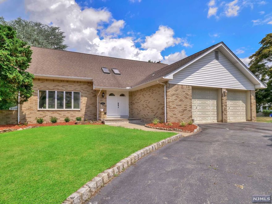 Totally updated Colonial in a great area of Pompton Lakes! Greet your guests in the grand 2 story entry foyer with skylights, which leads to formal living room with large windows that give off beautiful natural light. The living room flows nicely into the formal dining room. Beautiful hardwood floors run throughout the entire first floor. The kitchen offers custom cabinetry, stainless steel appliances, granite countertops, peninsula with bar stool seating and separate dining area. The open concept floorplan allows the kitchen to flow smoothly in the family room with floor to ceiling brick fireplace and large windows! Door leads to the backyard. A bedroom and full bathroom with stall shower complete the first floor. Retreat upstairs to find the primary suite with large walk-in closet and en suite. There are 2 additional sizable bedrooms and gorgeously updated bathroom with dual storage vanity and stall shower with sliding glass enclosure. Laundry room completes the second floor.