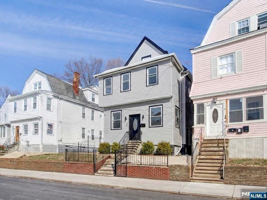 IF YOU HAVE BEEN SEARCHING FOR SPACE, MODERN UPDATES, AND A MOVE-IN READY HOME IN UPPER VAILSBURG, 23 KENMORE AVE DELIVERS WITH 5 BEDROOMS, A BEAUTIFULLY RENOVATED KITCHEN, AND A PRIVATE PRIMARY SUITE. WELCOME TO 23 KENMORE AVE, A BEAUTIFULLY RENOVATED AND MOVE-IN READY HOME LOCATED IN THE DESIRABLE UPPER VAILSBURG SECTION OF NEWARK. THIS SPACIOUS PROPERTY FEATURES A RARE 5 BEDROOM LAYOUT WITH 2 FULL BATHROOMS AND 2 HALF BATHROOMS ACROSS MULTIPLE LEVELS OF COMFORTABLE LIVING SPACE, WITH ALL NEW FLOORING THROUGHOUT THE HOME. THE MAIN LEVEL OFFERS A BRIGHT LIVING ROOM THAT FLOWS SEAMLESSLY INTO THE DINING AREA AND A STUNNING OPEN KITCHEN DESIGNED FOR MODERN LIVING. THE KITCHEN FEATURES QUARTZ COUNTERTOPS, STAINLESS STEEL APPLIANCES, MODERN CABINETRY, AND A LARGE CENTER ISLAND PERFECT FOR COOKING, GATHERING, AND ENTERTAINING. UPSTAIRS YOU WILL FIND GENEROUSLY SIZED BEDROOMS INCLUDING A SPACIOUS PRIMARY SUITE COMPLETE WITH A PRIVATE BATHROOM AND A WALK-IN CLOSET. ADDITIONAL UPDATED BATHROOMS THROUGHOUT THE HOME FEATURE CLEAN, MODERN FINISHES. THE PARTIALLY FINISHED BASEMENT PROVIDES FLEXIBLE SPACE IDEAL FOR RECREATION, STORAGE, OR A HOME OFFICE. STEP OUTSIDE TO THE REAR DECK OVERLOOKING THE BACKYARD, OFFERING A GREAT SPACE FOR RELAXING OR ENTERTAINING. CONVENIENTLY LOCATED NEAR PARKS, SCHOOLS, SHOPPING, MAJOR HIGHWAYS, AND PUBLIC TRANSPORTATION OPTIONS PROVIDING ACCESS TO NYC AND SURROUNDING AREAS.