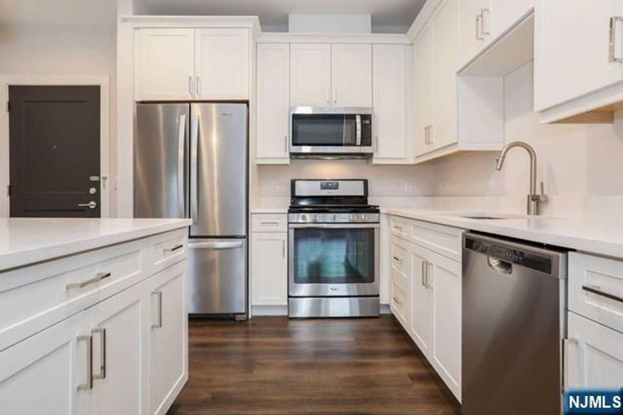 What meets the eye is a boutique building that stands out from the rest with its polished, yet classic exterior. The kitchen is where the heart of your home is. Finished with white quartz countertops and equipped with state-of-the art Whirlpool stainless steel appliances, ample soft-close cabinetry, and recessed lighting, every kitchen is a chef's dream. Our oversized bedrooms offer huge closets to hold your laundry, fresh from the full-sized washer/dryer in each unit. Every home benefits from thoughtfully chosen construction materials to assure privacy and comfort. All units boast grand scale Pella windows with custom solar shades, high-efficiency heating and cooling. Two car parking included.