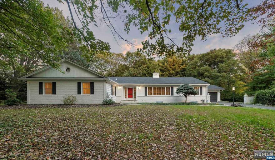 Discover the epitome of sought-after living in prestigious Saddle River with this exceptional opportunity. Offering a 9 room, 4 bedroom, 2.5 bath, Ranch Style home, nestled in the Chestnut Ridge Section, which sits on a (rare) level, 2 acre lot, in a tranquil cul-de-sac, presents a blend of privacy & comfort. Live in this well kept ranch style home or build with its perfect building envelope, it sets the stage for your dream home in a coveted neighborhood. This property offers the ideal canvas to build your custom residence, surrounded by other luxurious homes & a blank slate for your architectural vision, making the construction process a seamless and rewarding experience. This prime location combines the tranquility of suburban living with easy access to major metropolitan areas, ensuring you enjoy the best of both worlds. With top-rated schools, low taxes, scenic landscapes, and a close-knit community.