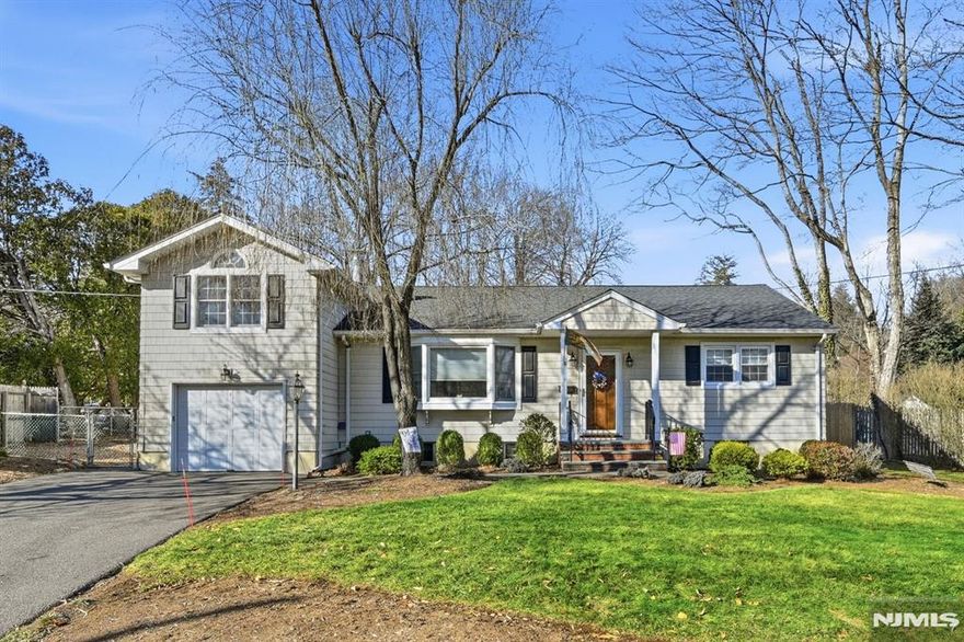 Spacious, expanded Ranch featuring living room with woodburning fireplace, eat in kitchen with skylight and dining room opening to vaulted great room with skylight which leads to private deck, perfect for entertaining! King size primary bedroom with walk in closet and skylit bath, two additional bedrooms and main bath complete the fire floor. Bonus 2nd family room over garage is perfect for playroom or home office. Finished basement with full bath , laundry and lots of storage plus 1 car garage all set on private property