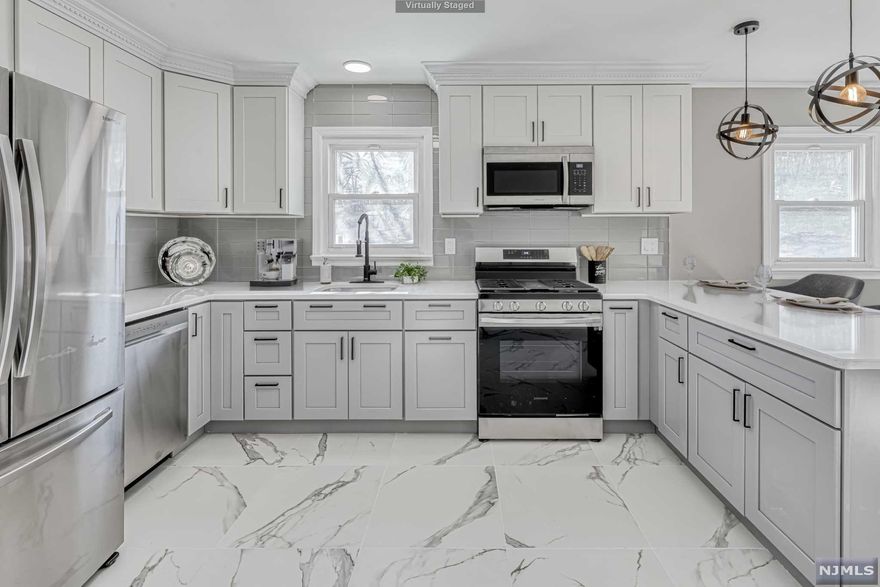 Completely turn key, charming ranch! This newly renovated home boasts two generously sized bedrooms,one bathroom, a gorgeous new kitchen, and a full-partially finished basement ready for you to bring your imagination to life. Entertaining has never been easier thanks to the gleaming, eat-in kitchen that has been meticulously remodeled and includes Samsung appliances, quartz countertops and a breakfast bar. Enjoy the outdoor lifestyle in your park-like backyard which includes 3 sheds, perfect for outdoor storage and lots of space for outdoor fun! Ideally positioned in a cul-de-sac neighborhood. A leisurely stroll to local shops. All the conveniences you could possibly need are a brief ride away. Public utilities and sewer water, a rare opportunity.