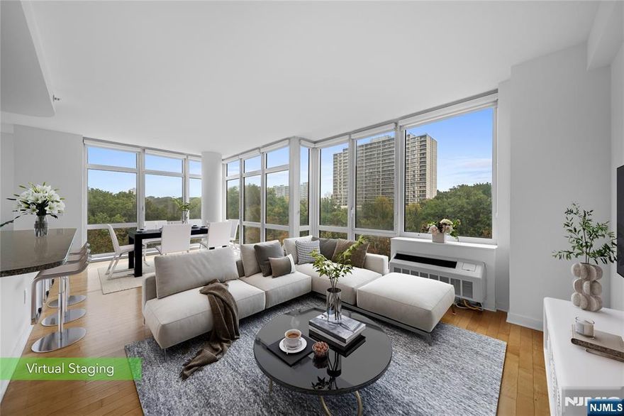 Beautifully Updated Corner Unit at The Trio! Bright Southeast Exposure & Serene Forest Views! Move right into this stunning, newly updated 2-bedroom, 2-bath condominium at the highly sought-after Trio. Built in 2007, this spacious corner unit offers approximately 1,385 sq ft of modern living w/ bright east and south-facing exposure and floor-to-ceiling windows that capture beautiful four-season forest views and abundant natural light. The open-concept layout features a modern kitchen w/quartz countertops, a stylish center island, and brand-new SS appliances, including a refrigerator, dishwasher, and LG washer/dryer. Both bathrooms have been newly renovated, and the entire home has been freshly painted for a move-in-ready experience. Enjoy high 9-foot ceilings, hardwood floors throughout, and generous closet space, including walk-in closets. Experience full-service living with luxury amenities, including: Concierge and doorman services, Fitness center, yoga studio, and golf simulation room, Lounge, childrenâ€™s playroom, and game room, Business center and on-site management. The monthly association fee covers heating gas, hot water, water, cooking gas, parking, and common area maintenance, offering exceptional value and stress-free living. Pet friendly and ideally located near shopping, restaurants, major highways, & NYC transportation, this private, bright corner residence combines comfort, style, and convenience in one of the areaâ€™s most desirable communities. A MUST SEE!