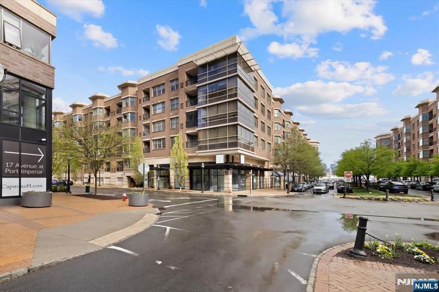 Luxury Condo at 20 Avenue at Port Imperial (Grandview II) highlights a spacious 1,385-square-foot unit. Features an open-concept living and dining area with hardwood flooring throughout. Equipped with custom cabinetry, granite countertops, and high-end stainless steel appliances. A private retreat including a walk-in closet and an ensuite bath with double sinks, a standing shower, and a Jacuzzi tub. Situated on the fourth floor, the unit benefits from southern exposure and offers a private balcony with views of the Manhattan skyline and Hudson River. Residents of the Grandview II building have access to premium community features an outdoor swimming pool, patio, and courtyard. A modern fitness center and resident lounge plus 24/7 concierge and an included indoor garage parking spot. On-site retail including restaurants, ice cream shop, ACME Markets, plus a free shuttle to ferry and light rail stations. The property is part of the vibrant Port Imperial waterfront, offering seamless transit to NYC.
