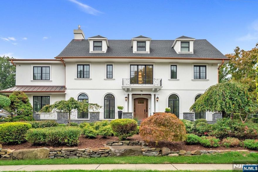 Set on a rare double lot, this stunning 6-bedroom residence offers over 5,200 square feet of uncompromising quality in Fort Lee's desirable Bluff neighborhood. Designed for both elegant living and effortless entertaining, the home seamlessly blends timeless style with modern functionality. The first floor presents a chefâ€™s kitchen with custom cabinetry and top-tier appliances, a dining room, sunroom, two living areas, a mudroom, and a powder room. Enjoy radiant heating on the first and second floors for year-round comfort. The second floor boasts a luxurious primary suite with a sitting area, fireplace, wet bar, terrace, dual walk-in closets, and a spa-like bath. Also on this level are an ensuite bedroom, two additional bedrooms with a shared bath, and a convenient laundry room. The third level includes two bedrooms, a full bath, and bonus space, while the finished lower level offers a wet bar, wine cellar, powder room, and a second laundry. Outdoors, a fenced yard with a paver patio, firepit, and sprinkler system awaits. A heated three-car garage with EV charging and gym completes this remarkable property, offering state-of-the-art systems. An exceptional opportunity for long-term value, with the potential to re-subdivide the lots and unlock additional investment possibilities.