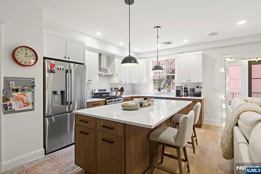 Expansive & stunningly renovated 2 bed/2 bath 1373 sqft home with balcony! The newly remodeled chefâ€™s kitchen features custom walnut & white cabinetry, white quartz countertops and a huge island. The spacious living and dining area is filled with light from French doors leading to your very own 152sqft balcony. The master bedroom has a custom California walk-in closet and an ensuite bathroom. There is also a large second bedroom and second bath with jacuzzi tub. Also included are gleaming oak hardwood floors, in-unit washer/dryer, central AC, recessed lighting, Casablanca ceiling fans, electronic blinds, video intercom, Bose surround sound system, and a private storage room. Conveniently located just steps from a municipal parking garage, bus to NYC, and Path train as well as shops, restaurants, and everything downtown Hoboken has to offer.
