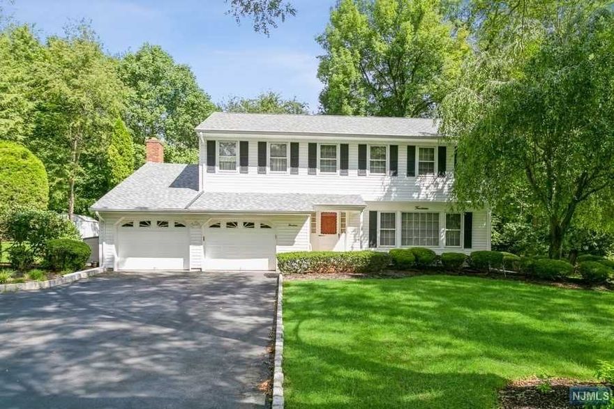 This stunning, pristine, colonial home located in the highly sought after town of Woodcliff Lake will not last. Walking into a entrance foyer, living room, formal dining room, eat in kitchen with granite counter tops, and sliding glass doors out to a large deck viewing the beautiful landscaped property. Also on the first floor is a half bathroom, laundry, and a large family room with a fireplace. Upstairs has a tremendous master bedroom with master bathroom, three additional bedrooms and full bathroom. Full finished basement with doors out to the back. This town offers top rated schools, a town pool, town fields, and EZ NYC commute by car, bus, and rail. Must see.