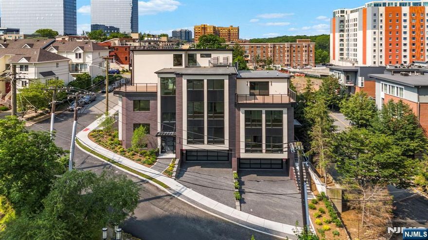 Welcome to 135 Old Palisade Road a luxurious new construction townhome that perfectly blends style, comfort, and functionality. This 3-bedroom, 3 full bath, 2 half bath home is thoughtfully designed with high-end finishes and modern details throughout, making it ideal for both everyday living and entertaining. Step inside to find beautiful accent walls, imported tile, and wide plank flooring that elevate the home's sleek, contemporary design. The open-concept main level features a spacious living and dining area that flows seamlessly into the chefâ€™s kitchen, complete with built-in appliances, custom cabinetry, and an extended island thatâ€™s perfect for gatherings. Huge bay windows bring in natural light and frame incredible views of a peaceful forest backdrop, with direct, views of the New York City skyline offering a unique combination of nature and urban living. Upstairs, the top level offers a private guest suite with a bedroom, full bath, and access to a rooftop terrace the perfect space to unwind or entertain under the stars. With every detail carefully crafted, this townhome is truly move-in ready and designed to impress. Don't miss your chance to own this exceptional property. Located near transportation, fort lee parks, George Washington bridge, and NYC!