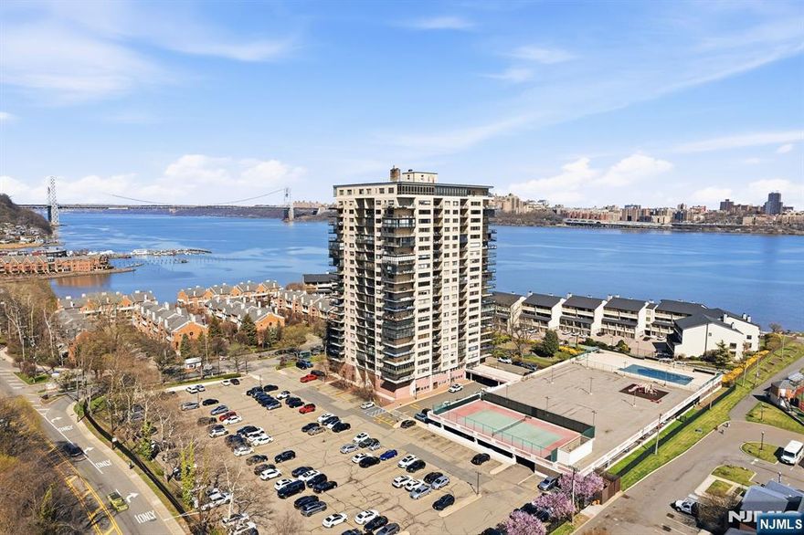 Beautiful Hudson Harbour condo, south facing with river view and play area, 1st floor unit feels like 3rd floor with beautiful Hudson NYC view, beautiful hardwood floors throughout. Very spacious living room with dining area for everyday living and entertaining, very bright and calm and peaceful feeling in this unit. all kitchen appliances renovated newly with bathroom, blinds, HVAC. 2 bedrooms are generously sized, and all utilities include in HOA for heat, hot water, electricity cooking gas, spectrum cable with internet package, easy access to waterfront walkway, highway, NYC transportation, just minuet from the Edgewater ferry, newly renovated fitness center, community room, outdoor pool, tennis court, and play area. Pets allowed.