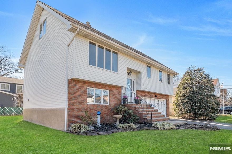 Welcome to this stunning custom bi-level two-family home, situated in the highly sought-after Richfield section. Offering exceptional space, versatility, & comfort, this meticulously maintained property is move-in ready. Home is set up for multigeneration living space. Enjoy the convenience of being close to everything as sidewalks lead to schools, parks, shopping - while benefiting from a quiet residential setting. From the moment you arrive, you'll appreciate the oversized two-car garage, abundant off-street parking, & the tremendous amount of storage space this home provides. Andersen windows throughout, central air, & quality craftsmanship elevate both comfort & style. The main residence features 5 generous bedrooms & 3 full bathrooms. The primary suite includes two closets & its own private bath. The first floor showcases a bright & spacious living room, a formal dining room, & a large eat-in kitchen that opens directly to the deck perfect for entertaining or relaxing above the beautifully fenced-in backyard. The ground-level suite is a major highlight, offering a private entrance, a full bedroom and bath, and a layout ideal for guests or potential rental income. Additional upgrades include a brand-new washer and dryer, newer central air, & three zones of efficient baseboard heat. This exceptional home combines size, flexibility, and premium features in one of Clifton's most desirable neighborhoods.