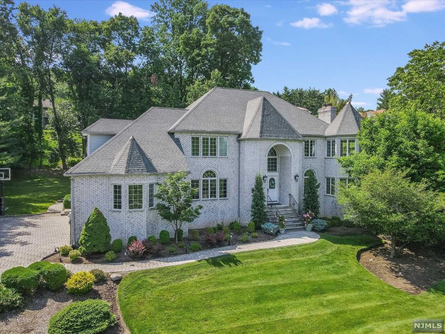 Custom built for these current owners, this 5600 sq ft center hall colonial has beautiful, open spaces set on a double cul-de-sac- in prime Upper Saddle River location! 5 BR, 4 full & 2 half bths w/ soaring ceiling heights, beautiful moldings & custom details throughout. Formal Living rm w/ beautiful adjacent sitting rm, DR & incredible Kitchen/Great Room/Family Rm w bar area! Hardwood flrs & walls of windows for loads of natural sunlight. First flr office & powder rm. Den/Breakfast Rm, 1st floor Guest Suite & mud rm addition added on 10 years ago, adding to an incredible first flr layout. Upstairs, spacious Primary Suite w/ gas fpl, sitting rm & lg primary bth. 3 addt'l BR's (one ensuite) plus hall bth. Huge finished lower level incl. billiards room w bar,rec room,huge cedar closet,storage & more! All set on a double cul de sac location w 3 c garage, wonderful privacy & quality custom construction! Newer roof, furnace, AC units all 10-11 years old! Poured concrete foundation!