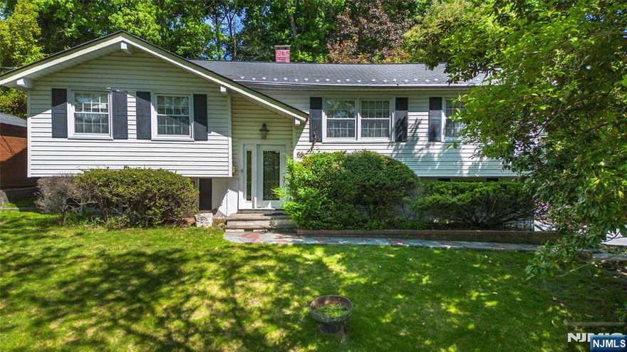 Amazing opportunity located in a wonderful and desirable neighborhood - Welcome Home! Large Bi-level - Oversized living and dining room. Eat in kitchen with a sliding glass door leading to a large private patio to enjoy the outdoor living. 3 Large bedrooms, primary bedroom has private door access to the full bathroom for convenience. Huge family room with brick fireplace and powder room. Additional Features: Updated central air conditioning, hot water heater and windows, and 2 car garage. Property is being sold "As Is Condition" only due to cosmetic potential- No known issues. Buyer is responsible for Wayne Township CCO and fire inspection before closing. Great location. Top rated school system, wonderful town activities. Minutes to major highways, restaurants, shopping, Whole Foods, Trader Joe's, township library and NJ Transit Bus and Train Center.