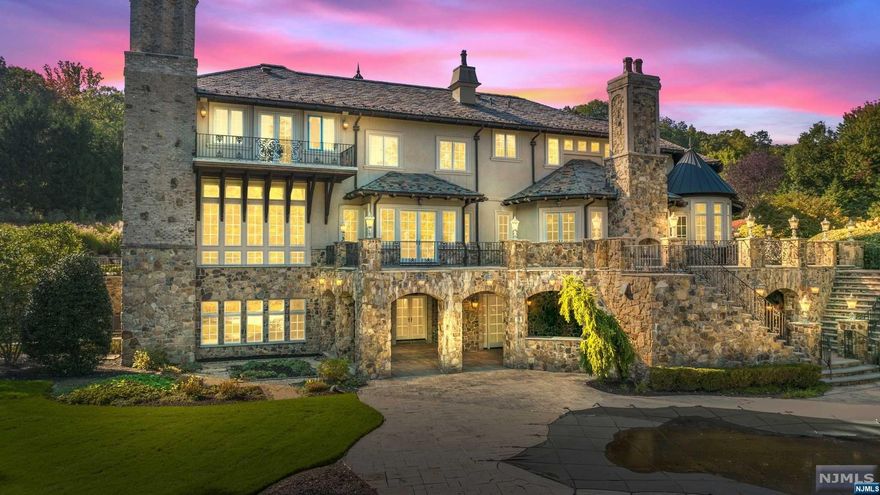 Welcome to this magnificent 10,000 sqft masterpiece designed by renowned architects Beer & Coleman, nestled w/in the exclusive enclave of "The Pond. This private gated estate greets you through the portico and as you enter the grand foyer w/ dual staircases, your gaze will be captivated by the cathedral-stained glass dome designed by artist mark Bogenrief. The entire home is adorned with designer finishes, new hardwood floors, arched doorways, and soaring ceilings. Entertain with ease in the sprawling great room, complete with wet bar and access to the billiards room and wine library. The heart of the home, the kitchen, is adorned with dual islands, a custom-built pizza oven, barrel ceilings & sculpted granite countertops. Step outside into your own private paradise - the resort-like grounds boast a 2-hole golf course, stone terrace w/fireplace, and a covered kitchen. The 1,600 sq.ft executive center inc. 2 office suites, conf. room, kitchenette & bath. Elevator to all 3 floors