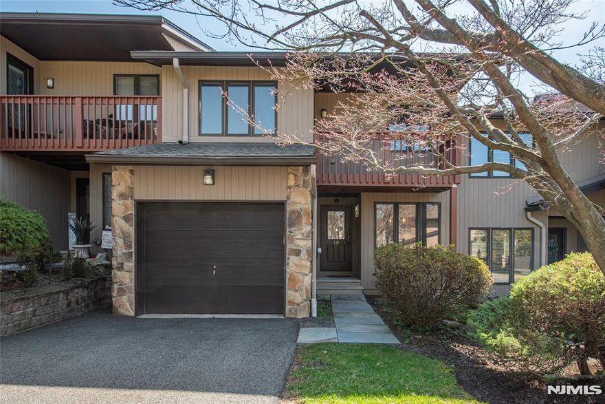 Location. Location. Location. This "Sycamore" model unit features 2 bedrooms, 2 full baths, 1 half bath and 1-car garage. A full finished basement affords additional space resulting in a total of 2,000 SQFT (approx.). Walk through the front to an open floor plan with dining room and living room that boasts vaulted ceiling and wood burning fireplace (easily convertible to gas), kitchen with eat-in area and powder room. Kitchen includes new, never-used, stainless steel appliances: air fryer, dishwasher, microwave, cooktop range, refrigerator, sink with water filter and wall oven. Sliders off dining room to deck and nice yard space. Up the stairs bring you to both bedrooms, each with their own qualities... Primary with great closets, jacuzzi-style tub, skylight and stall shower; second with convenient hall bathroom and skylight along with private door to balcony deck. Down the stairs is where you will see the large spacious main room, walk-in closet, additional spare room, and laundry room. Now, about the location, both the area which is conveniently accessible to major roads, transportation close by, much local dining and shopping, and the actual unit location where one can easily walk to the swimming pool, courts (both tennis and bocce) with the added convenience of visitor parking for your guests who will appreciate that and enjoy coming over. And as if all this isn't enough, Wedgewood Knolls is in the heart of Garret Mountain, a hidden gem of the Passaic County parks system.