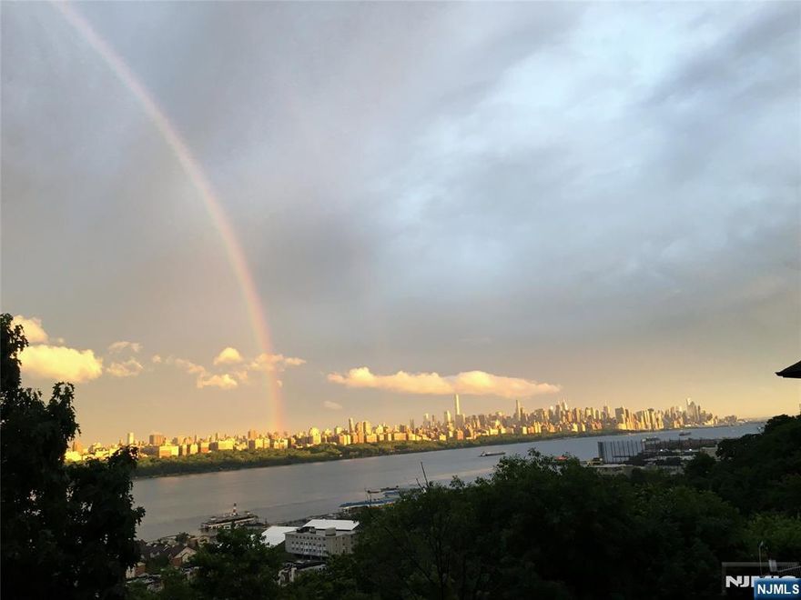 ***A commuter's dream home!*** Stunning , bright southeast corner 2Bed /2 Bath Southeast Corner Residence with partially NYC & Hudson River Views . The spacious layout includes a modern kitchen with new finishes, an in-unit washer and dryer, C/A/C, hardwood floor and well-proportioned bedrooms for comfortable living. One indoor parking space with storage included in a well maintained secured elevator building. Dining and shopping are just around the corner, offering incredible convenience. Commuting is a breeze with the NJ Transit bus stop at the corner and a shuttle to the Weehawken ferry terminal, making travel into Manhattan quick and seamless. This condo combines comfort, style, and locationâ€”an excellent place to call home. A must see!!! Just 5 minutes to Wholefoods, Trader Joe's at next door, River Road & Ferry to NYC