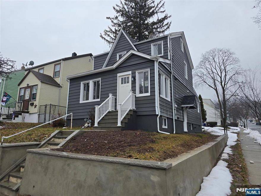 Beautiful, newly, fully renovated (2025, 2026) 1 family colonial on corner lot which features: Sun-filled Entrance foyer. 1st Flr: Opened concept flr plan w/ LR, Modern Kit, DR & LR. The new Kitchen has new SS appliances (oven/range, refrig,DW, microwave), quartz tops & backsplash, plenty of new Shaker cabinetry. 1 BR, 1 Full Bath w/ tile, Side Door off Kitchen to 1st flr & basement & Back door to yard. Hardwood Hickory flooring w/ 3" wide planks as installed throughout 1st & 2nd Flrs. 2nd Flr features 2 BRs, 1 office/nursery w/ access to 3rd flr attic. 1 Full Bath w/ tile. 3rd Floor: Attic w/ storage. Central Air/Forced Air/Gas Heat Basement is full unfinisheed w/ W/D hook-ups, storage space. New electric (200 amp),& plumbling (see seller's disclosure), new windows as installed throughout. New Roof. Newly Renovated 1 car detached Garage w/ newly finished indoor space, electrical outlets, vinyl flooring. Garage has new roof. Off-street parking in driveway. Must See!