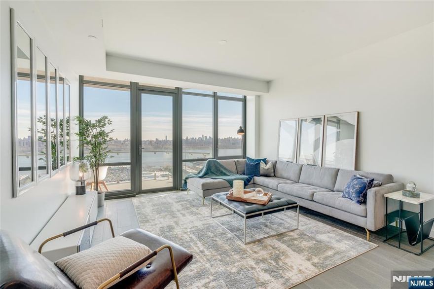 Gorgeous 3-Bedroom Condo with Iconic NYC Views â€“ One Park Condos, North NJ Welcome to luxury living at its finest in one of Northern New Jerseyâ€™s premier full-service buildings â€“ One Park Condos. This stunning 3-bedroom, 2-bathroom residence offers 1,534 sq ft of elegant interior space and an incredible 323 sq ft wraparound balcony with breathtaking north/east-facing views, including a picture-perfect panorama of Midtown Manhattan. Step inside to discover floor-to-ceiling high-performance windows that flood the home with natural light and frame spectacular cityscapes. The gourmet kitchen is a true chefâ€™s dream, outfitted with Thermador Pro Series stainless steel appliances, polished Cielo Quartzite countertops, and a matching full-height backsplash. Both bathrooms are spa-inspired retreats, featuring polished Bleu de Savoie porcelain wall slabs, porcelain floor tiles, and custom walnut vanities with elegant porcelain sinksâ€”a flawless blend of luxury and function. One Park Condos offers an array of resort-style amenities, including 24/7 concierge service, state-of-the-art fitness center, indoor pool, sauna, rooftop deck, residentsâ€™ lounge, children's playroom, and more. This exceptional home is the perfect blend of sophistication, comfort, and convenience. Schedule your private tour today and experience the lifestyle that awaits at One Park.