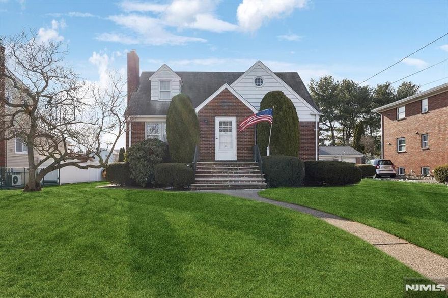 Welcome home! PRIME LOCATION in the heart of Elmwood Park. Experience the charm of this EXPANDED 2,313 sq ft Cape Cod style home. Sitting on a MASSIVE LOT totaling approx .34 ACRES of flat land. 1st floor includes 2 beds, 1 full bath, cozy living room w/ wood burning fireplace, dining room, well appointed kitchen & an enclosed porch. 2nd level offers 2 beds w/ built in drawers & ample closet space & partial dormer attic. Also features a large detached 2-car garage with/ half attic, long driveway parking & a full, partially finished basement, providing ample storage and endless possibilities for customization. Hardwood under all carpets. The backyard is ENORMOUS fully fenced in featuring numerous gardens, shed and dog kennel. Approximately 500 feet from Gall Ave Park (bball courts, baseball, playground). Conveniently located near schools, shops, parks & restaurants, this home offers not only a great location but also generous living space. Elmwood Park is centered approximately 10 miles from the GW Bridge & is in close proximity of all major highways. Don't miss out on this incredible opportunity. Truly a must see for owner-occupants and investors. Schedule a showing today!