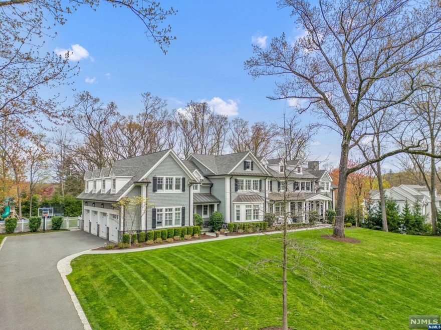CREME DE LA CREME! That best describes this spectacular 6 year young colonial estate located in one of the most coveted neighborhoods in Franklin Lakes.No expense or no detail has been over looked in the design of this (approx) 7500 SF beauty.Extensive architectural details and mill work includes coffered 10 foot ceilings on the1st floor & handcrafted woodwork throughout.Expansive gourmet kitchen w/spectacular center island,3 dishwashers,Wolf appliances(including 4 ovens) and Sub-Zero refrig.& freezer. Banquet-sized formal dining room, exquisite formal living room w/ marble gas fireplace. Tranquil owners retreat includes a sitting rm, gas lineal fireplace & extravagant spa bathroom.Four Ensuite bedrooms+ laundry room complete this level.Finished walk-out LL w/add'l. 3500 SF (making the home's total @ 11,000 SF)including family room w/fpl,2 FBTHS,2 offices,theater & 500 gallon salt water fish tank.Outdoor smart pool & shower,outdoor kitchen,elevator,generator + so much more.