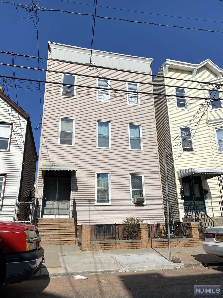 3 Family - All 3 apartments have 2 bedrooms, living rm, kitchen & bath. Owner pays heat. Tenants pay gas, electric & hot water. Unfinished basement.