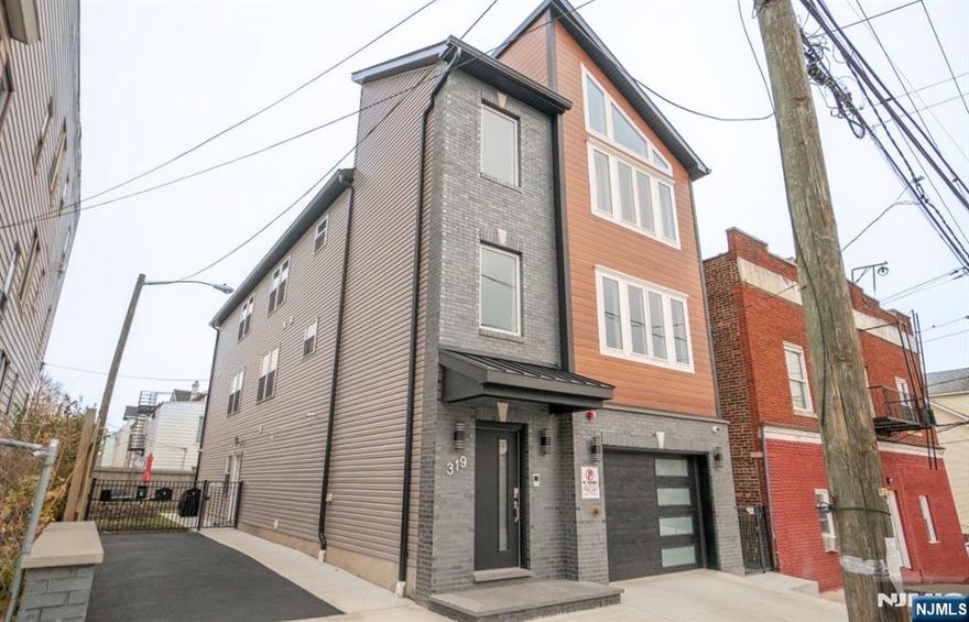 Turn-key, newer construction two-family home, just two years old, offering strong income potential, flexibility, and long-term tax savings. Unit 1 features 5 bedrooms and 3 full bathrooms, with a finished basement. Unit 2 offers 3 bedrooms and 2 full bathrooms and is currently tenant-occupied, providing immediate rental income. The property includes a 2-car garage and private driveway parking located on the left side. Approximately three years remain on the existing tax abatement, offering significant savings to the next Owner. Excellent opportunity for Owner-occupants looking to offset mortgage expenses or investors seeking a low-maintenance, income-producing property.