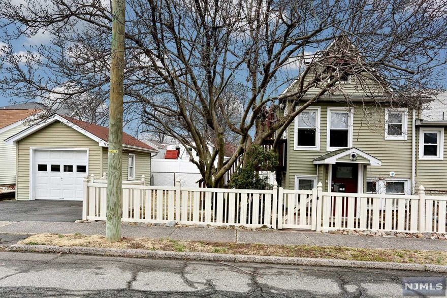 Unique opportunity to live in cottage/condo-like setting in Fairlawn w. all the benefits of home ownership-a private yard, detached garage + 2-car driveway, 2 floor living, + a full stand-up attic with lots of storage space or expansion possibilities. Street level entry to a mudroom/foyer + adjacent kitchen w. new floor and LED lights, while second floor includes addt'l living space, bedrooms and a new bathroom. The fenced side yard has 2 safety latches on gates and is perfect for relaxing outdoors, pets or a garden. A stand-out opportunity for buyers or investors! All appliances, ceiling fans and brand NEW Friedrich 8000 BTU AC/Window unit included in sale as well as Seller's Home Warranty Protection. Hot water heater is located in shared basement of duplex.