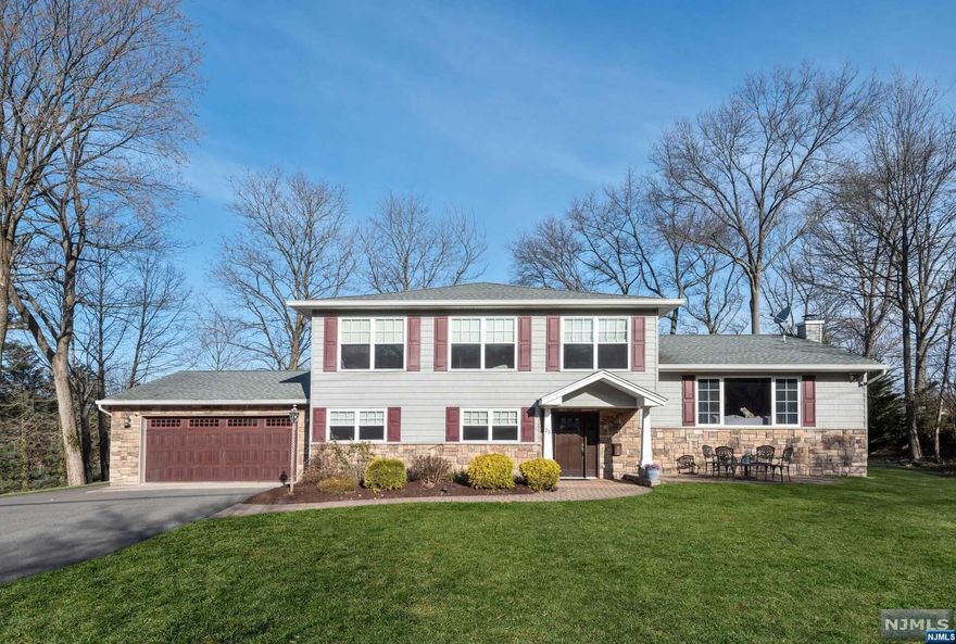 Beautifully renovated and expanded Split Level on a lovely tree lined street in Wayne. This remarkable home will delight your most discerning clientele. The 4 Bed, 3 Bth home has been renovated with the finest materials. The Open Plan LR, DR, EIK flow seamlessly. The kitchen island with stone counter anchors the Kitchen, which includes JennAir appliances. The DR offers sliders to the yard and the L R has a spectacular pic window w/lots of light. The Grnd Flr has a large FR,BR, Bath and Lndry Rm. This level also has access to the large garage as well as sliders to the paver patio. The 2nd floor features the Primary BR and Bath, with double sinks and a 2-fixture shower that must be seen! Two BRs and a Bath complete this level. The finished basement offers the ultimate play space for young and old and all ppl in between. The outdoor Patio is the perfect place to relax around the firepit or in the hot tub (negotiable). 3 zone heat and A/C complete this home.