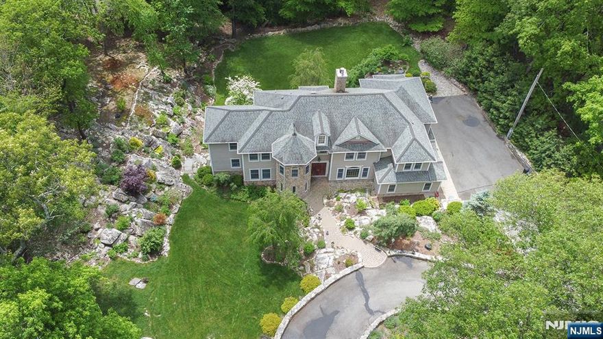 Your dream home has arrived! Nestled on a private lot with serene natural landscaping, this 2006 custom-built gem in the gated Smoke Rise community blends comfort, space, & tranquility. Enjoy quiet mornings in nature or entertain indoors & out. The light-filled main level features a chefâ€™s kitchen, cozy family rm with fireplace, office, and multiple living areas. Upstairs offers 4 oversized bedrms, a massive laundry rm, & a versatile 2nd fl living space. The finished walkout lower level includes a spacious rec room & flexible space for a gym, media room, or guest suite, plus an alternative high-efficiency pellet heating system. Outside, natural stone, tasteful hardscape, & lush foliage surround you. Smoke Rise boasts one of NJâ€™s liveliest social scenesâ€”clubs, dining, beach, tennis, sports bar, fishing, swimming, 24/7 gated security, and more--all near major highways and NYC transport. (Note: taxed as a 3BR, functions as 4.) Donâ€™t miss this rare opportunityâ€”schedule your tour today!