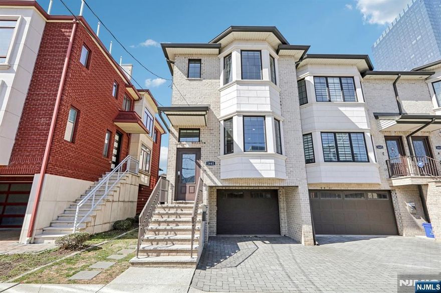 PRIME LOCATION! This townhouse rental is very clean and freshly painted. Top floor features a primary BR facing East w/ dual closets, plenty of light, and ceiling fan. Primary BA is spacious w/ dual vanity sinks, walk-in shower, jetted soaking tub, and tiled floors. High ceiling hallway w/ washer and dryer, storage closet, a full bath, additional 2 BRs each w/ a closet. Main floor features a spacious living room w/ crown moldings, gas fireplace, large casement windows, coat closet, and half-bath. Dining room opens into a modern kitchen w/ stainless appliances, tiled back splash, tall cabinets, quartz countertops, kitchen island w/ built-in microwave, and access to elevated, backyard, deck. Ground floor features a den/rec room, half-bath, add'l storage closets, utility closet, and access to garage. Hardwood floors throughout, central AC and heating w/ central vac. Just mins to GWB, parks, shops, easy access to major highways, schools and restaurants.