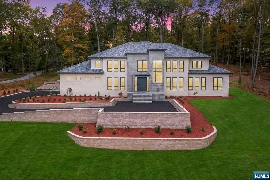 This newly built smart home blends modern design w/perfection. Highlights include Portuguese Limestone exterior, grand foyer w/Sintered stone floor, Metal pivot entry door, modern staircases w/glass railing, DR with wine cellar, great room w/Ethanol fireplace & built-in freshwater tank surrounded w/blue onyx .The Kitchen by Leicht, is equipped w/Gaggenau appliances. A 55 ft long heated salt-water pool w/infinity edge & spa awaits outside.The family room offers built-in furniture; bookshelves, an ethanol fireplace & pandora marble. Bathrooms boost high-end vanities, LED mirrors & wall hung toilets by Duravit & Geberit. The 1st flr Master suite features a 16ft sliding door, sitting area & a spacious bathroom w/free-standing tub, 2 showers, dual vanity & walk-in closet. The 2nd level boosts 3 bedrooms w/baths & the 2nd master suite includes Italian wide plank HW flrs & a luxurious bathroom. Don't miss the chance to explore this extraordinary home! Also listed in GSMLS #3871245