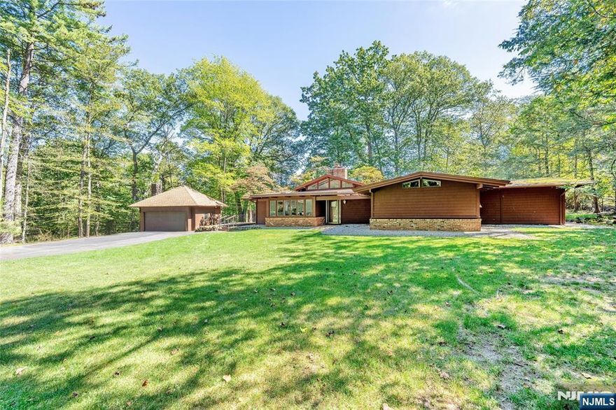 COME AND VIEW THIS UNIQUE AND UPDATED 3/4 BEDROOM, 2 FULL BATH, CUSTOM CONTEMPORARY "FRANK LLOYD WRIGHT RANCH. SITUATED ON A PRIVATE LANDSCAPED .95ACRE PROPERTY WITH AN IN GROUND HEATED GUNITE POOL. OPEN FLOOR PLAN WITH VAULTED CEILINGS AND PLENTY OF SUN LIGHT THROUGH OUT. MAIN LEVEL: ENTRY FOYER, FORMAL DINING RM, MODERN EAT IN KITCHEN WITH DINETTE AREA & DRS TO SIDE YARD, STEP UP TO A LG.GREAT RM/FPL, PRIMARY BR/DRS TO PRIVATE POOL AREA & LUX.BATH/JAC&SS, HALLWAY FULL BATH/SOT, 2 MORE GOOD SIZE BEDROOMS. THE GROUND LEVEL: LG.4TH/BR OR OFFICE OR THEATER MAKE IT YOUR OWN CHOICE, LAUNDRY RM. THE PARTIAL BASEMENT IS UNFINISHED AND OFFERS GOOD STORAGE AND UTILITIES. 2 CAR DETACHED GARAGE ATTIC STORAGE AND OLD FIREPLACE, HAS NEVER BEEN USED BY PRESENT OWNER. IN CLOSE PROXIMITY TO SCHOOLS, SHOPPING, PUBLIC TRANSPORTATION. TOTAL SERENITY AWAITS YOU IN THIS MOVE IN CONDITION HOME. A MUST SEE!!