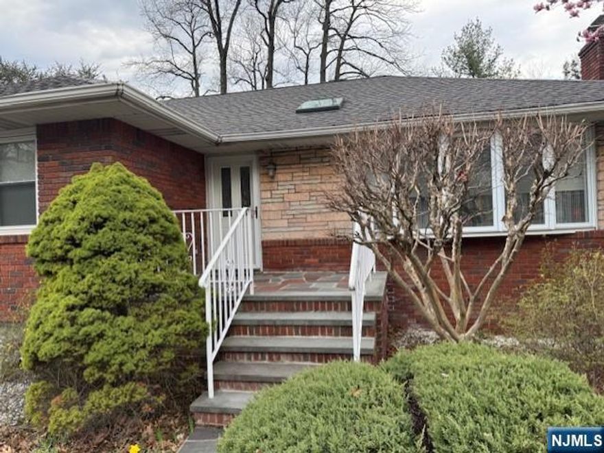 Nestled on a serene, beautiful street on the east hill of Leonia. Well maintained raised Ranch step into the sun filled spacious open floor plan featuring a large formal Living Room w/Fireplace and Skylight, Dining Room and a fully equipped eat-in-Kitchen, Sunroom, exit to Back Yard. Master Bedroom and 2 Bedrooms with a full Bathroom. Lower level features a large Family Room, Computer Room, another Sunroom with serene back yard views, large full Bath w/Jacuzzi and steam Shower. Laundry Room, Office and storage Rooms. Back yard features a spacious Deck for outdoor entertaining Two Car Garage, newer Roof and central Air. Don't miss this opportunity to own a beautiful, updated Ranch with versatile living options in this desirable neighborhood.