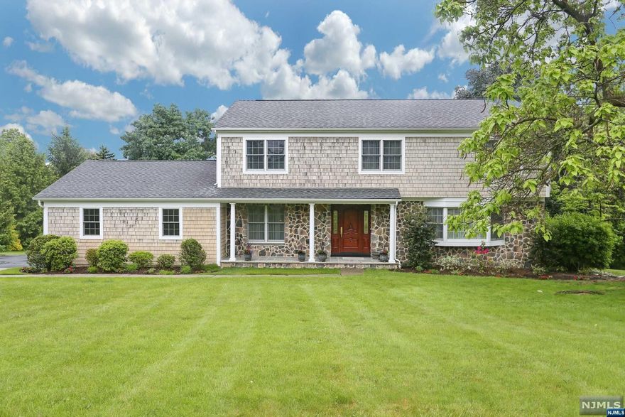 Beautiful center hall colonial in ultra desirable USR offers 4 bedrooms & 3.5 full bathrooms. Home has great curb appeal with an inviting front porch with stone & cedar shake siding & meticulous landscaping. A welcoming foyer greets you immediately. Quality craftsmanship throughout with beautiful wood trim details & high end finishes. Classic CH layout with LR & banquet size DR reside on either side of the foyer. Gourmet kitchen w. Ken Bauer solid maple cabinets, granite countertops, Viking & SubZero appliances & a breakfast nook w. French doors to a generous deck that overlooks the park like grounds. Family room has a FP & French doors to the deck. Upstairs boasts primary bedroom w. an en suite bathroom, WIC & 3 additional bedrooms & full bathroom. Finished lower level w. media area, wet bar, gym / bonus room & full bath. Oversized 2 car garage. Meticulously maintained home, nothing to do but move in. Wonderful community, convenient train to NYC & excellent schools. Do not miss!