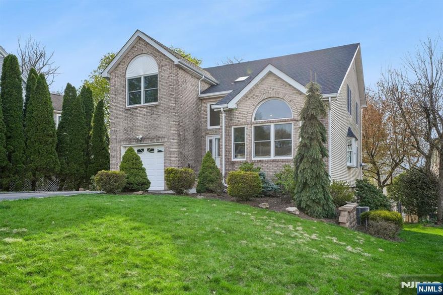 Tucked at the end of a quiet cul-de-sac, this is effortless living at its best. Just over the hill from Montclair and moments from restaurants, shopping, and NYC-bound transit, this beautifully updated home offers the space, flexibility, and ease today's buyers crave - all wrapped in a setting that feels calm, connected, and just right. Across the back of the home, a sunlit kitchen and family room create the true heart of daily life - open, inviting, and designed for everything from busy mornings to slow, easy weekends. It's the kind of space where everyone naturally gathers and lingers. Spacious dining and living areas are filled with natural light, anchored by a stunning arched window that brings warmth, character, and an undeniable sense of joy to the home. Upstairs, 4 well-placed bedrooms offer a sense of retreat and separation from the main living areas - comfortable, practical, and perfectly suited to the rhythm of everyday life. And then, the flexibility everyone hopes to find: a walk-out lower level with multiple rooms and a full bath offers a rare opportunity to live the way you need to - guest suite, home office, playroom, or extended living -all with easy access to the backyard. Outside, the cul-de-sac setting brings a sense of ease - where neighbors connect, bikes roll, and evenings wind down with beautiful sunsets. All just moments from parks, shopping, and NYC-bound bus and train options.Space, flow, and flexibility - designed for the way you live now.