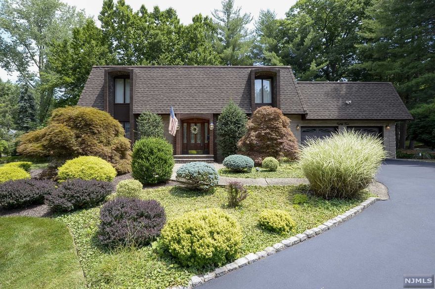 Mask Required thank you. Beautiful Center Hall Contemporary Colonial with amazing Architectural Design. Enter into the soaring 2 story foyer surrounded by an abundance of natural light! Spacious Eat In Kitchen; Plenty of Custom Cabinets, Corian counters, center aisle, breakfast bar & stainless steel appliances. Inviting Living Room with a gas fireplace and a formal dining room( both with gleaming hardwood floors). Wonderful open flow for entertaining. Spacious Master Bedroom and huge Master Bath(all good size Bedrooms with lots of Closet space). Family room; custom built in's, wet bar, full bath plus wall to wall closets including 2 cedar closets and so much storage! Private serene Blue Stone Patio . Mature landscaping with sodded grass and a sprinkler system. Circular driveway fits 8 cars. Great Schools, new playground nearby, close to shopping, highways & public transportation.