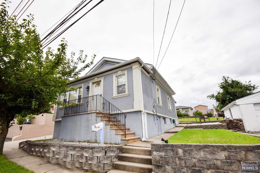 Welcome home to this well maintained, affordable 2/3 bedroom ranch style home located in a quiet non flood section of town. This property is the perfect starter home but also offers potential for expansion or conversation into a two family as it is located in a two family approved section of town. The home offers a open floor plan in the main living area with a living room w/ hardwood floors which leads to a spacious eat in kitchen. There are also two bedrooms and an additional potential 3rd bedroom or den/family room in the back section of the house. The backyard offers a patio and great views of the area. There is a newer roof on the house and stucco exterior. The unfinished basement includes a laundry area. This property is conveniently located near schools, shops and close to major highways!