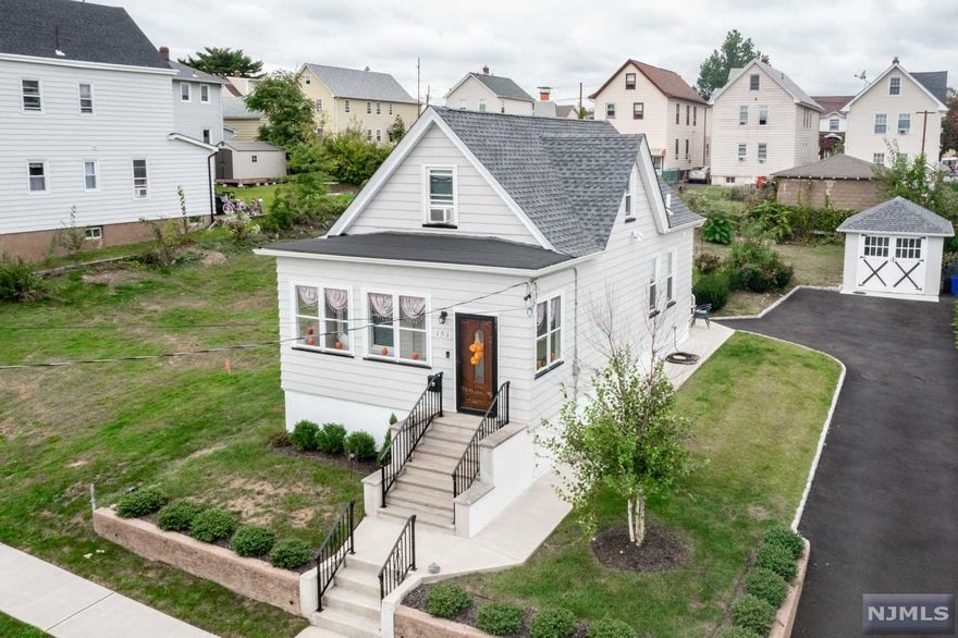 Welcome to this pristine, commuter dream home (only half a block from Plauderville Train Station) located in a quiet residential area located within a close proximity to schools, parks and major highways. Step inside to a front porch followed by a cozy living room, dining area, gourmet kitchen, beautiful full bathroom and one bedroom on the first level. Second floor offers 2 bedrooms and half a bathroom. Full unfinished basement that could be easily completed for additional family or play room. You will be pleasantly surprised what this tastefully done home offers - Central A/C, prefinished hardwood floors throughout, recessed lights, custom kitchen with stainless steel appliances, granite counter tops and much more! Enjoy rear secluded yard great for entertainment. Plenty of off-street parking in the driveway.