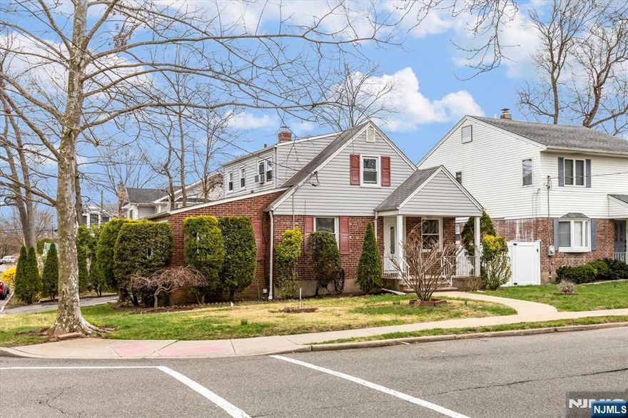 Move-in condition Brick and Vinyl Cape Cod with an inviting covered front porch; the perfect combination of location and potential. This home features a welcoming living room, an updated granite kitchen, dining Room/Den, two bedrooms and an updated full bathroom on the first floor. The second floor has two bedrooms, lots of light and a full shower bath. The basement is fully-finished with a ceramic-tiled floor, space to play, laundry area, half bathroom and furnace area. Attached garage, two car driveway and private fenced yard. Close to NYC buses, shops, parks, schools and houses of worship.
