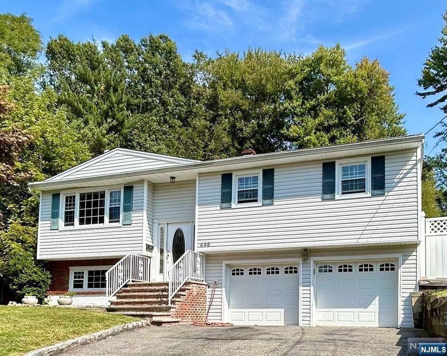 Move-in ready 3-bedroom, 2-bath home nestled on a quiet street in Northvale NJ. Featuring an open layout with hard wood floors, a bright living room with a wood burning fireplace, full dining room and kitchen with sliders to the back deck. The lower level includes a large family room, full bathroom and a laundry room with walk out access to backyard plus a two-car garage with plenty of storage. Conveniently located near great parks, shopping, restaurants and minutes to the NY border, just 18 miles to the George Washington Bridge. Don't miss the chance to make this home yours today!