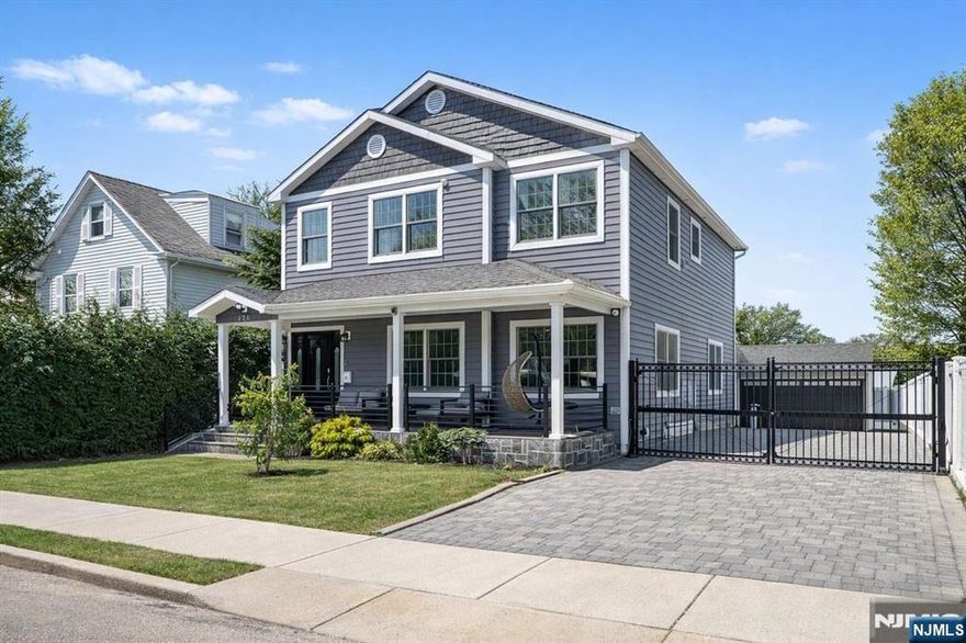 This beautifully renovated Englewood home, updated in 2017, features a bright open-concept first floor, ideal for everyday living and entertaining. Gorgeous hardwood floors, spacious bedrooms, and generous walk-in closets create a seamless sense of comfort, flow, and understated elegance throughout. Outside, the property truly shines with a large paver driveway accommodating 8+ vehicles, a double garage, and a backyard perfectly suited for summer entertaining, relaxing, or gathering with family and friends. Thoughtfully designed for modern living, the home offers Andersen 400 Series windows, a fully paid-off Tesla solar panel system, and a fully integrated smart home setup controlling lighting, doors, and heating. Additional highlights include a climate-controlled garage with an EV-ready outlet, whole-house water filtration, advanced drainage, fully replaced plumbing, a fully updated electrical system, and much more for peace of mind. The depth and quality of this renovation reflect that it was completed by the owner for personal use, not as a flip. Every detail was thoughtfully executed using high-quality materials and finished to an exceptional standard. A full, detailed list of features and upgrades is available at the home. Be sure to request it. Ideally located near Tenafly and just steps from NYC bus transportation, this home delivers a rare combination of location, space, intelligence, and lasting quality.